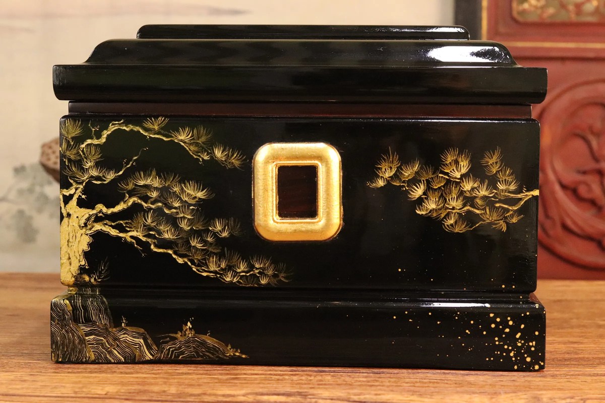 Ink Pine Lacquer Urn — gold pine branch across a deep lacquer field