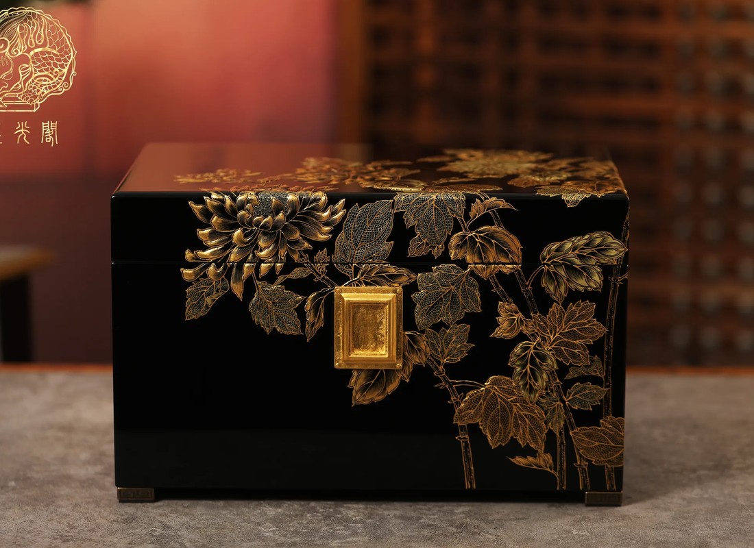 Lacquer urn with hand-painted golden chrysanthemum branches on a black ground