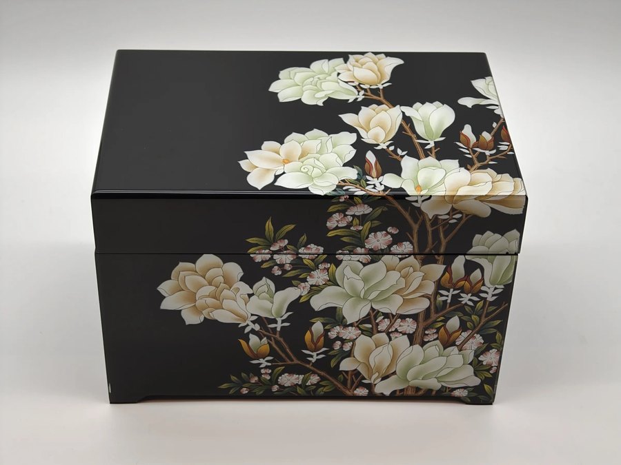 Grace Collection — Magnolia Tribute Lacquer Urn, magnolia branches opening in white against black lacquer